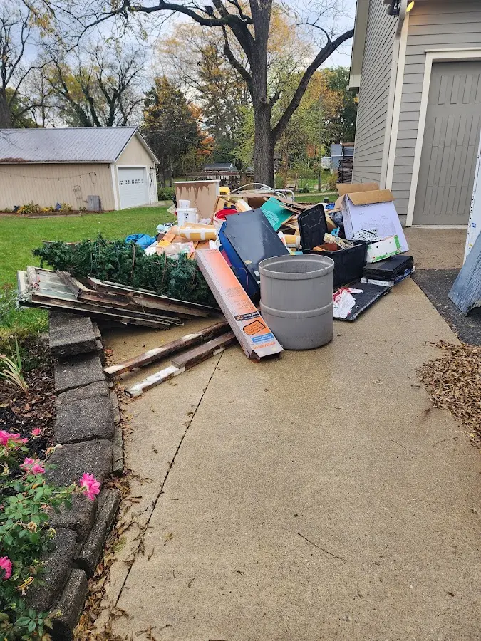 Dumpster being loaded with debris for Estate Cleanout Dumpster Rental in Kentfield